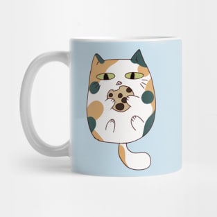 Calico cat eating cookie Mug